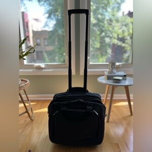 Traveler’s Choice Rolling Carry-On for Laptop and Clothes